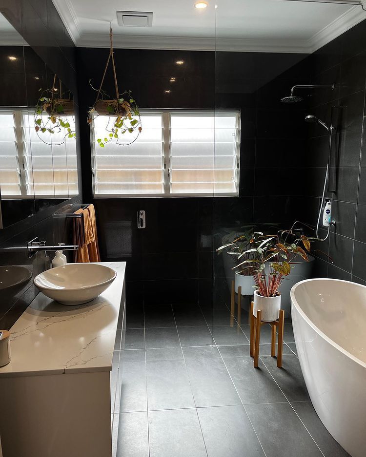 A Bathroom With A Tub, Sink And Mirror — Lake Macquarie Designer Kitchens In Newcastle, NSW