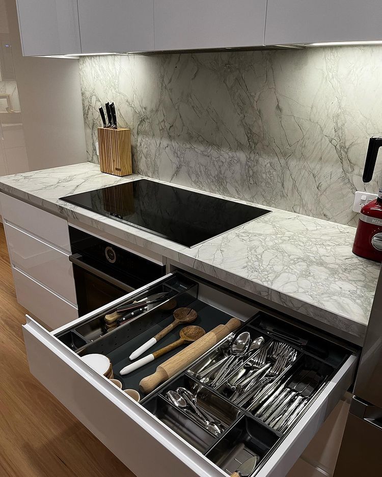 A Kitchen With White Cabinets And Silver Appliances — Lake Macquarie Designer Kitchens In Morisset, NSW