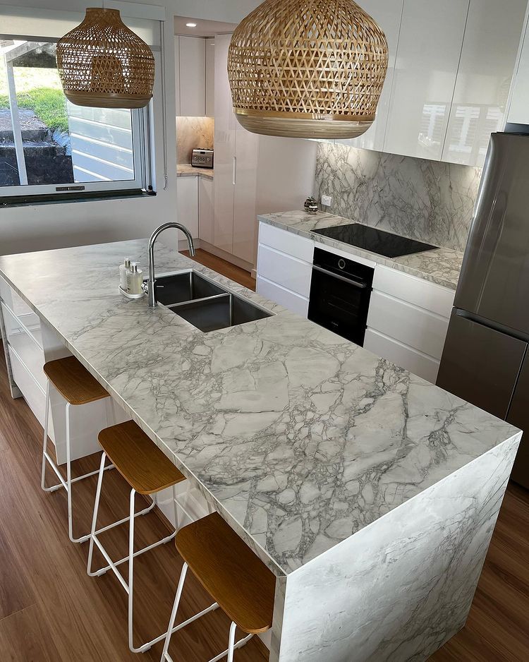 A Kitchen With White Cabinets And Marble Counter Tops — Lake Macquarie Designer Kitchens In Bonnells Bay, NSW