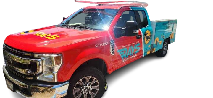 A red truck with a surfboard on top of it.