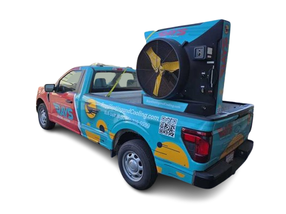 A truck with a fan attached to the back of it