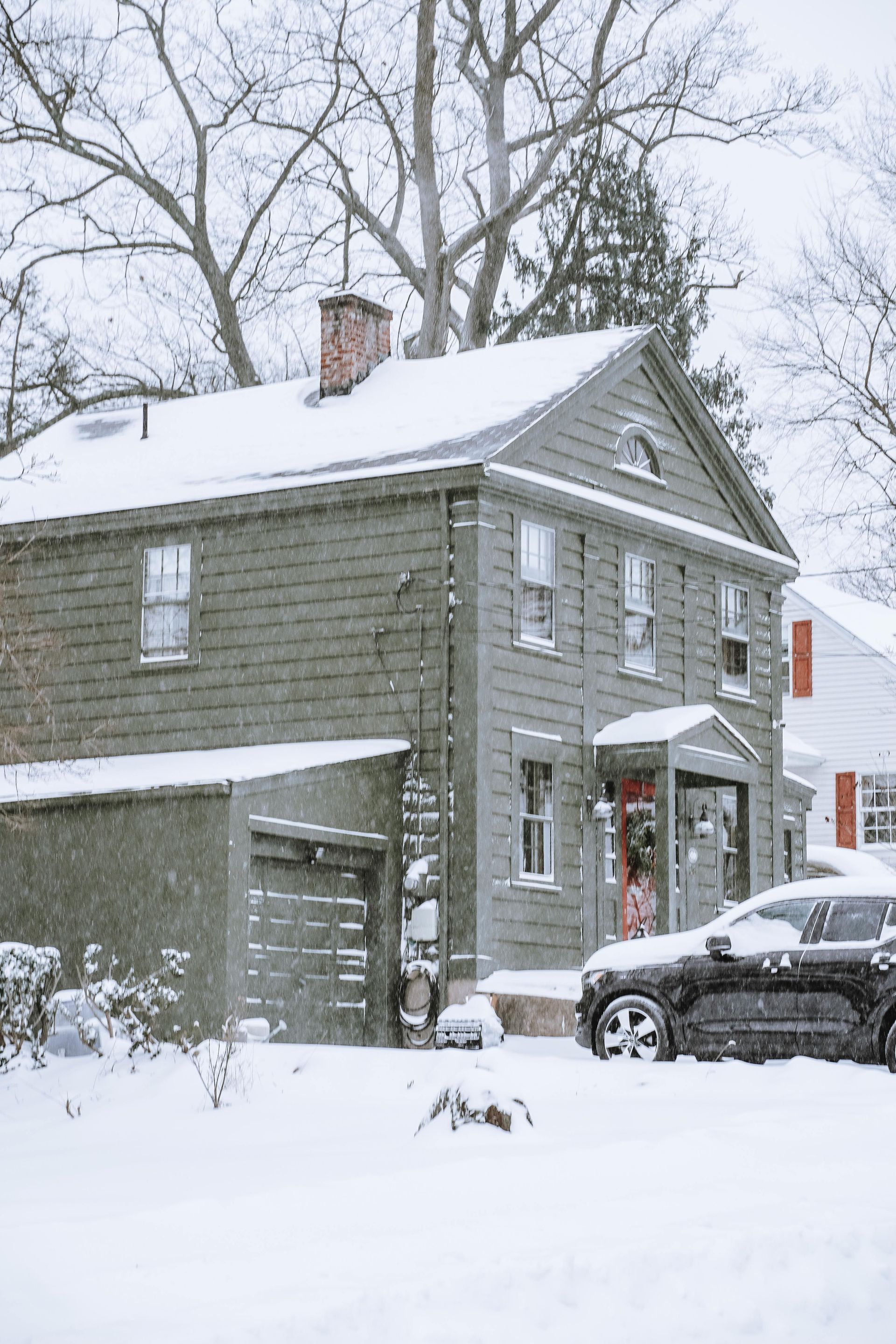 a huse with a roof covered in snow after a storm