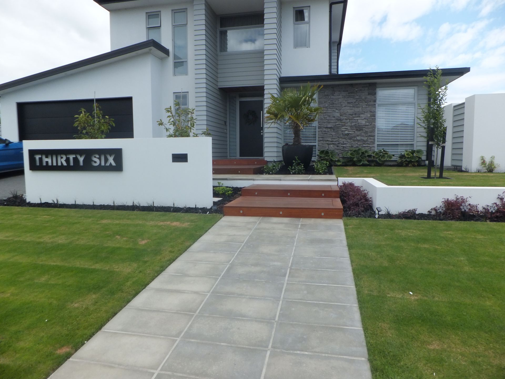 A white house with the number thirty six on it