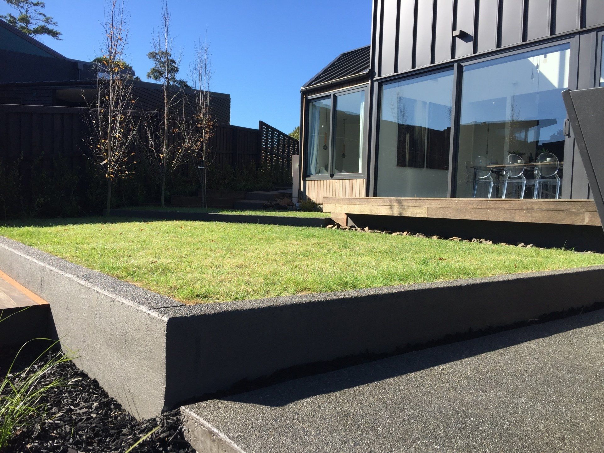 A house with a large lawn in front of it