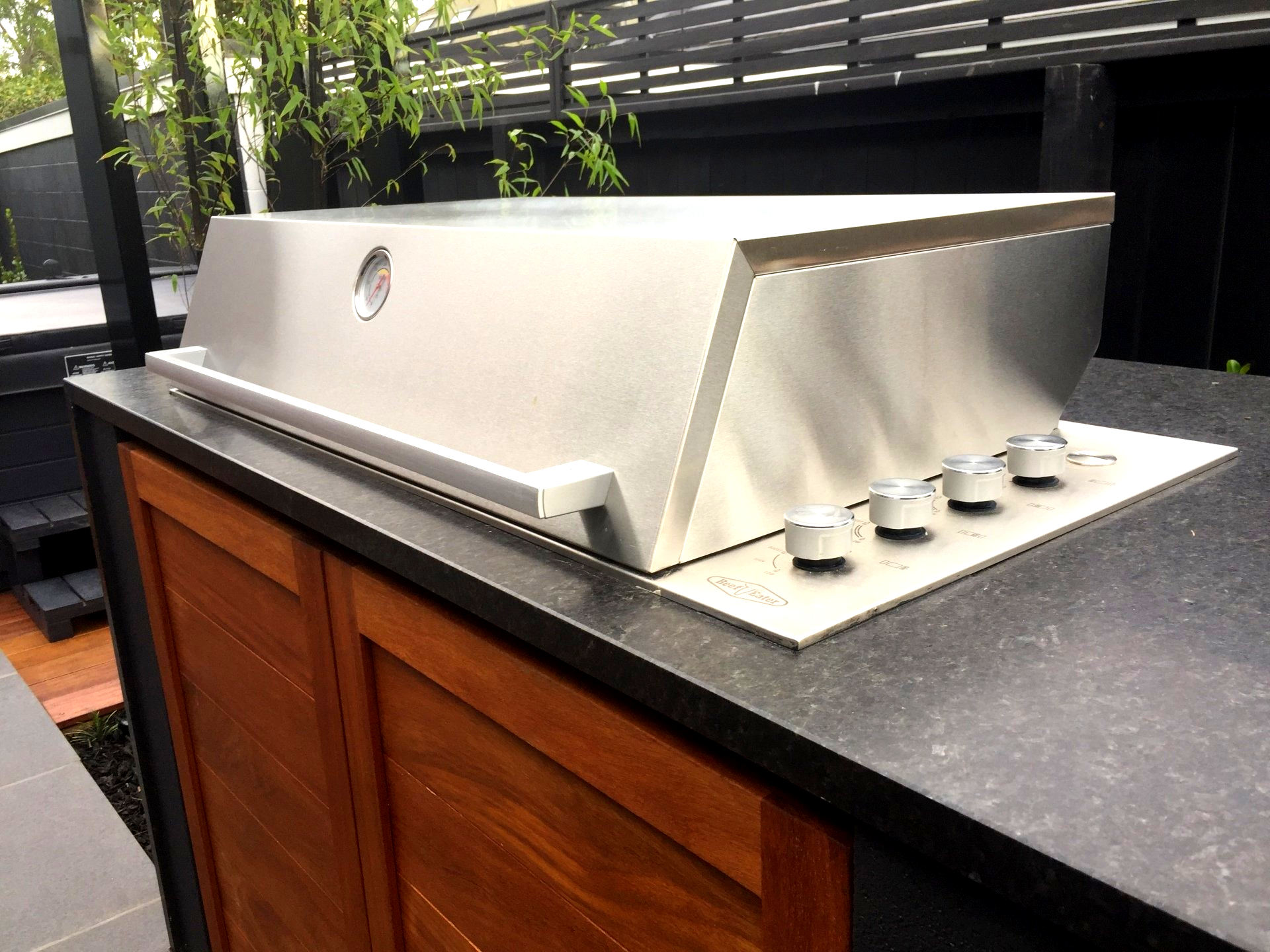 A stainless steel grill is sitting on top of a counter
