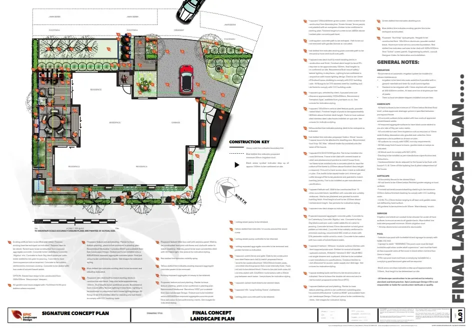 A metal fence with holes in it is lit up at night.