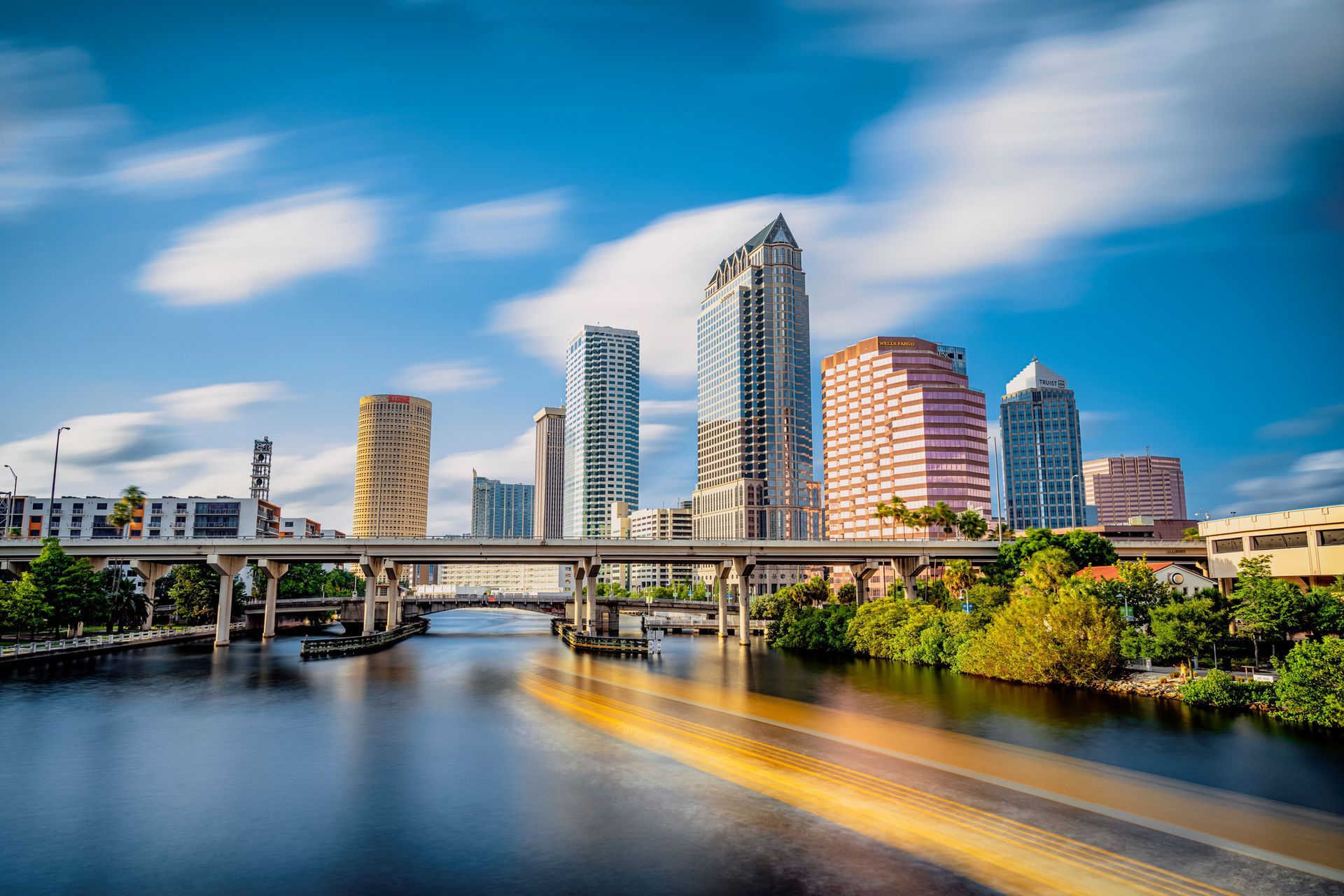 The Tampa, Florida skyline with a bridge over the river in the foreground.