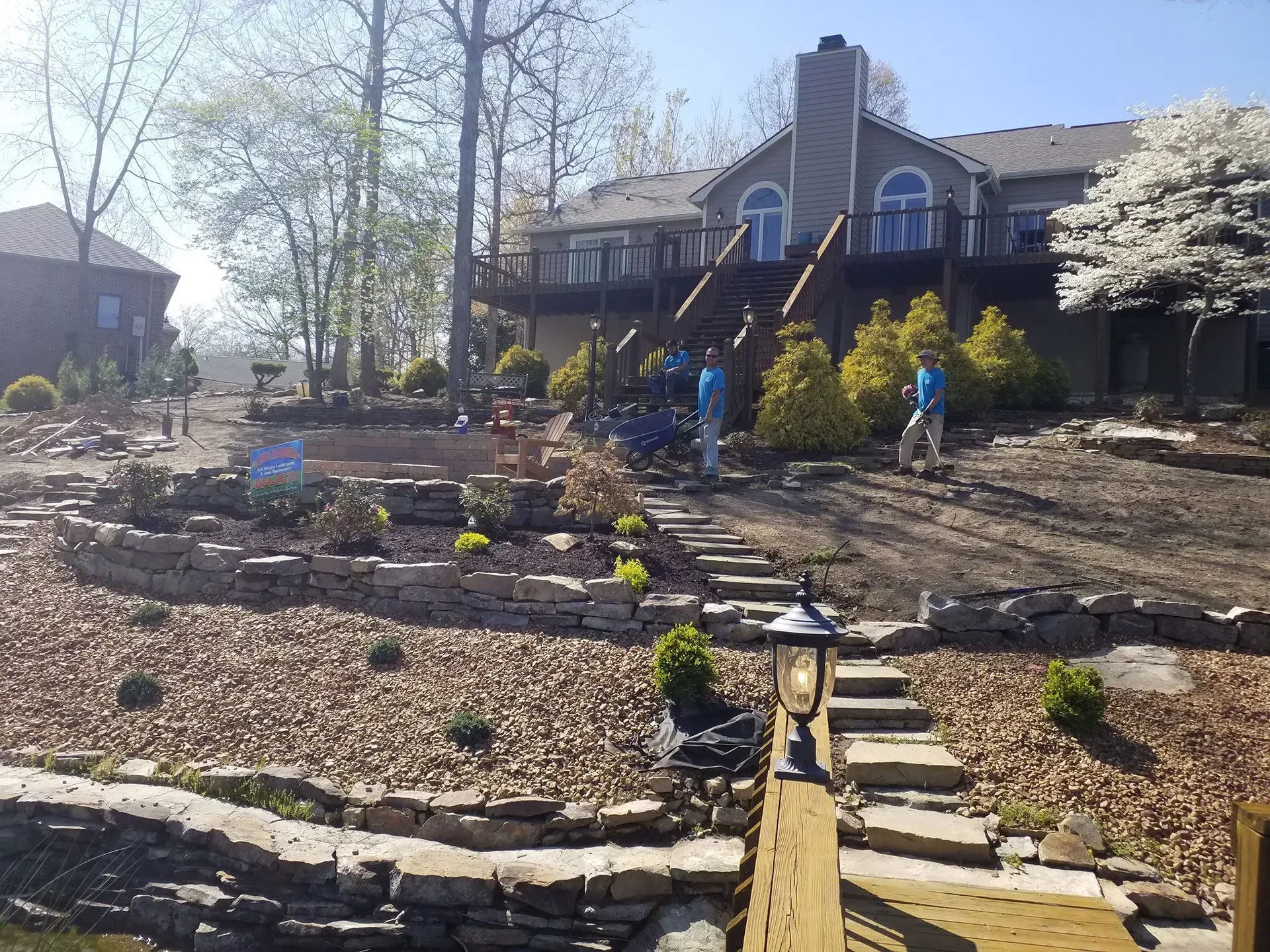 A large house with a large deck and stairs leading up to it.