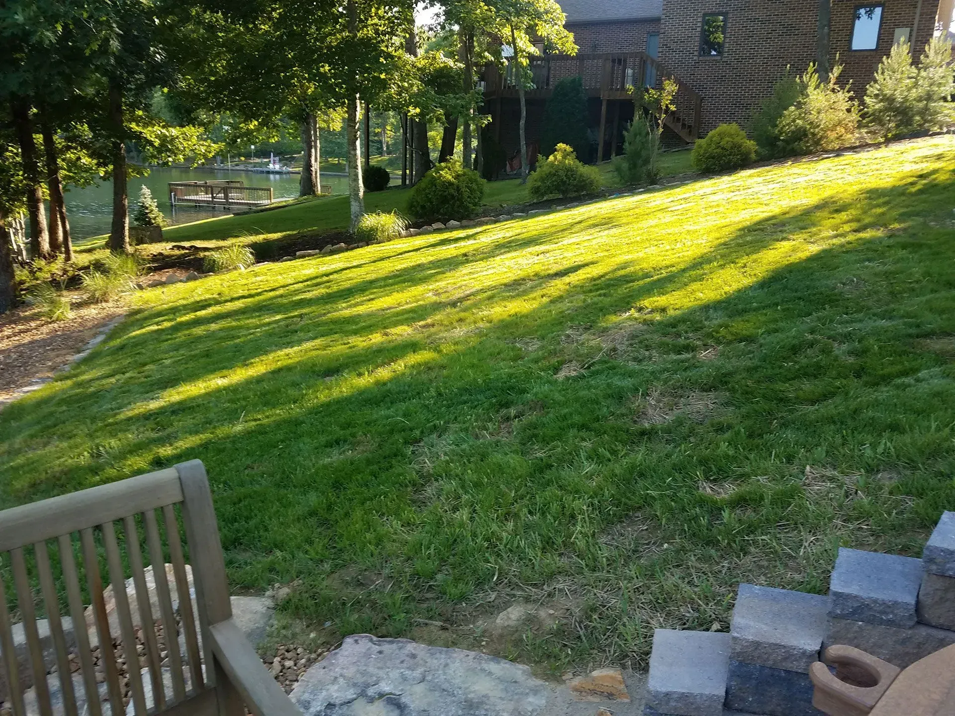 A beautiful tended lawn in front of a house.
