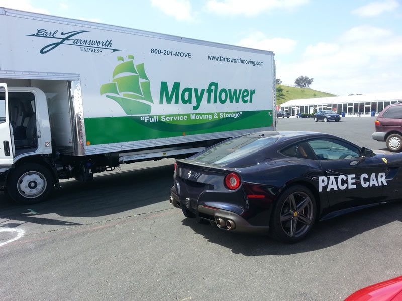 A Race Car is Parked in Front of a Mayflower Moving Truck | San Rafael, CA | Earl Farnsworth Express