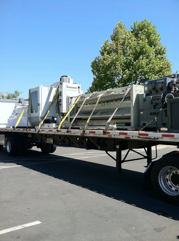 A Semi Truck with a Machine on the Back of it | San Rafael, CA | Earl Farnsworth Express