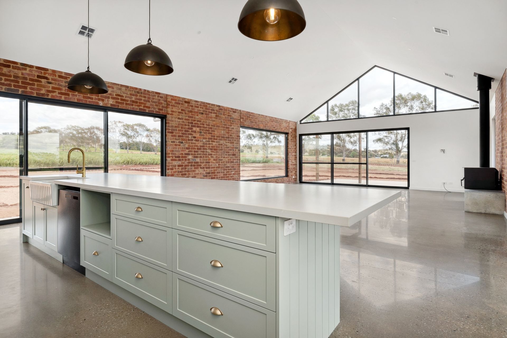 There is a large island in the middle of the kitchen.