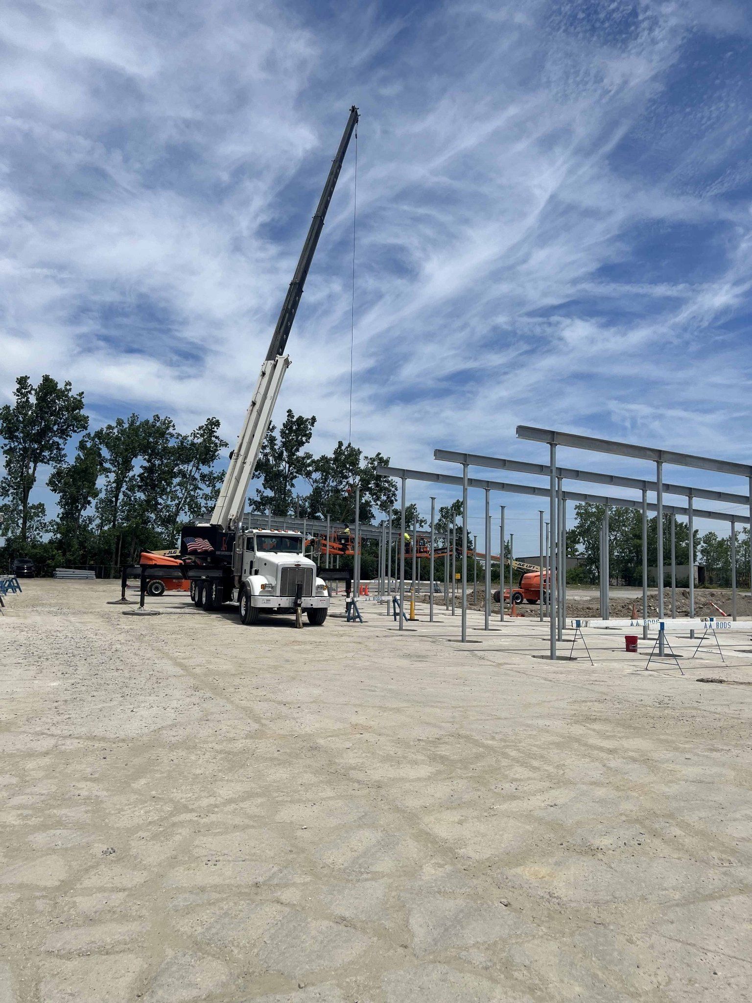 Truck With Crane Lifting Steel - Perrysburg, OH - Tech Dynamics Inc