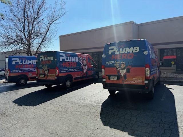 A white bathtub is sitting in a bathroom next to a window.