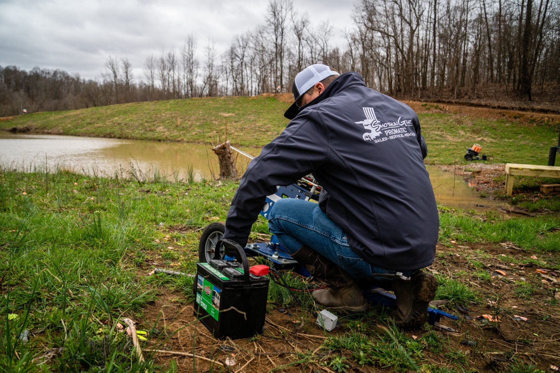 Image of a shotgun gear employee working on a machine