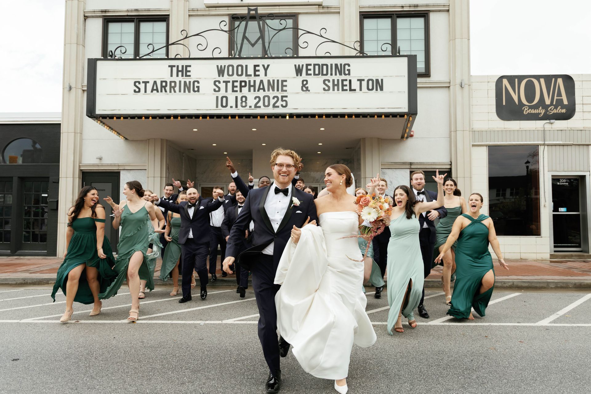 Newlyweds exiting a theater with wedding party. Marquee: 