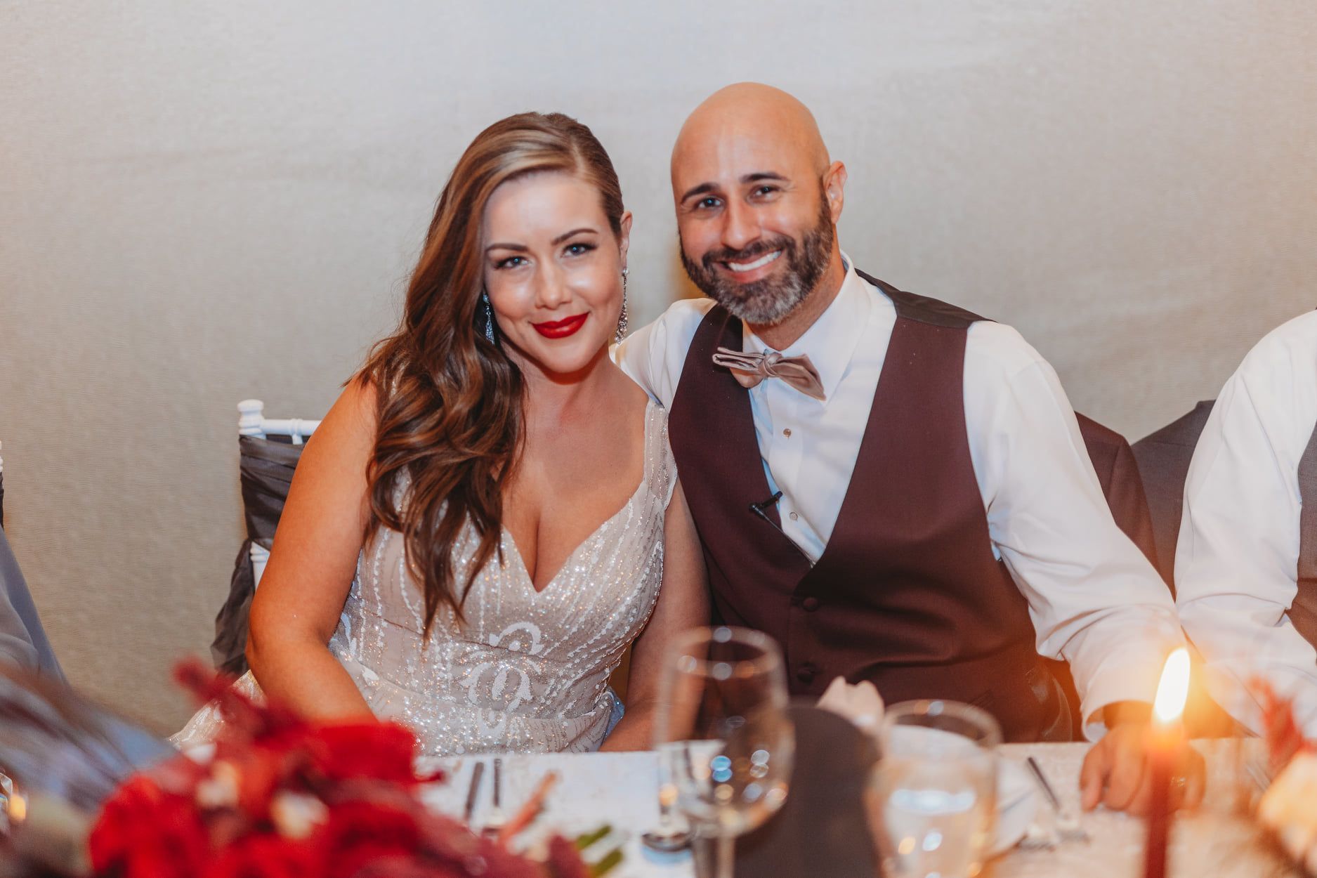 Party at a club with a DJ booth, laser lights, and crowd raising arms. DJ Bryan logo is displayed.