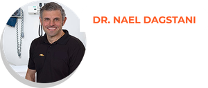 Dr. Nael Dagstani smiling, in a medical setting.