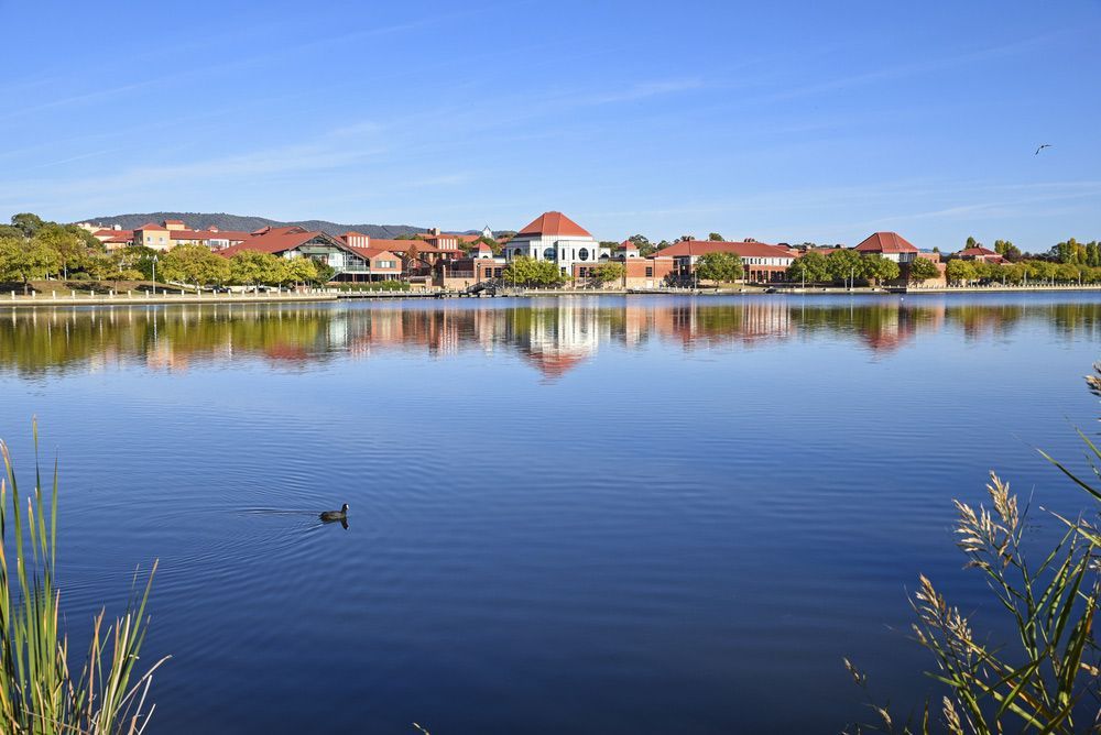 Early Morning View Of Tuggeranong City From The Other Side Of The Lake — Carpets & Flooring in Tuggeranong, NSW