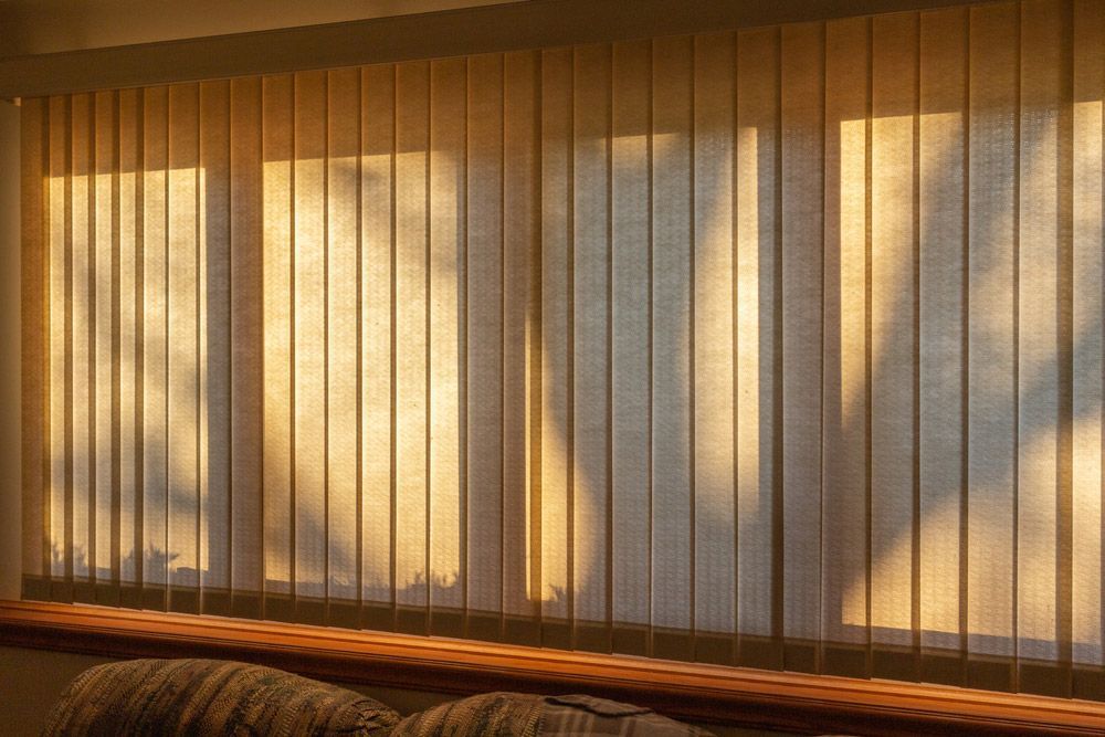 The Sun Is Shining Through The Vertical Blinds On The Window — Carpet in Bungendore, NSW