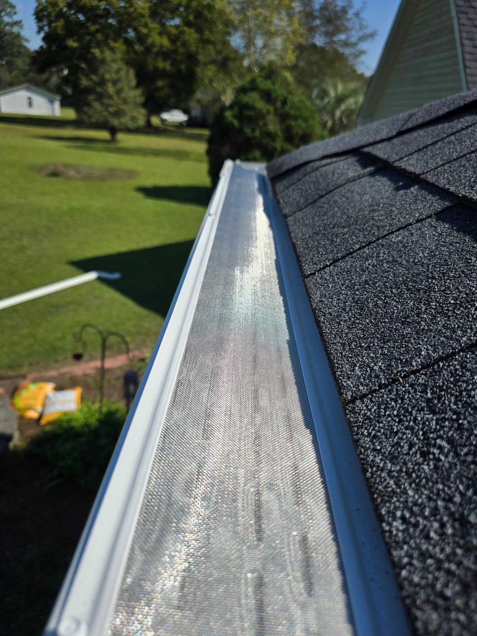 A close up of a gutter on top of a roof.
