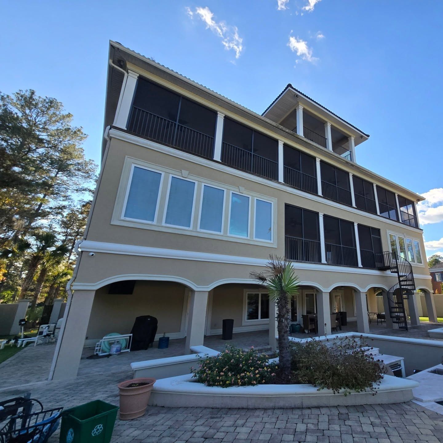 A large house with a lot of windows and stairs