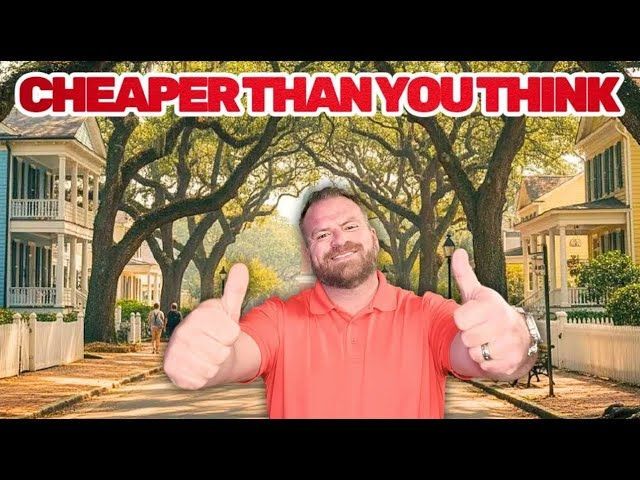 Man with thumbs up in front of a street lined with houses, text: CHEAPER THAN YOU THINK.