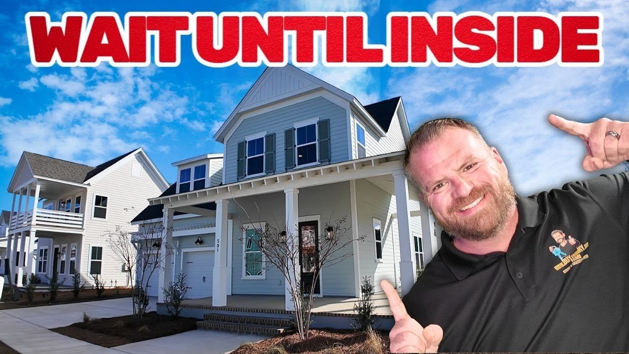 Man points at house with