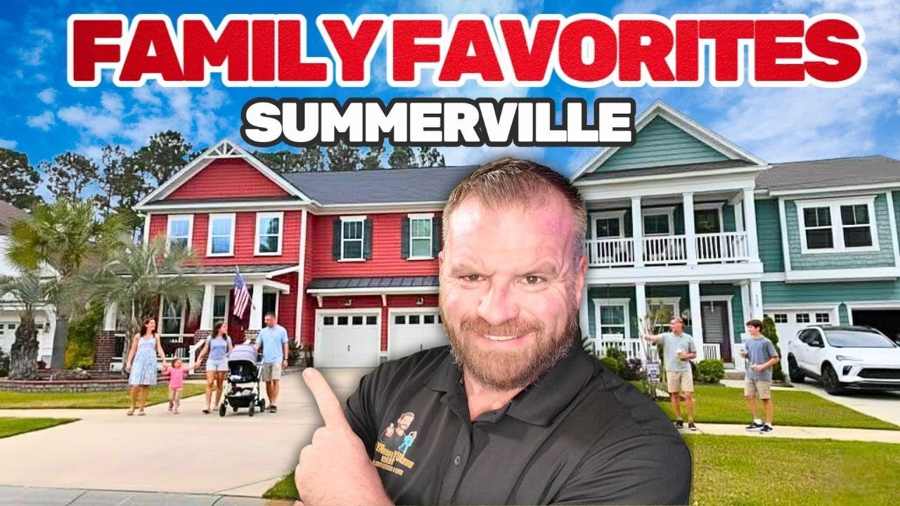 Man pointing in front of houses; 