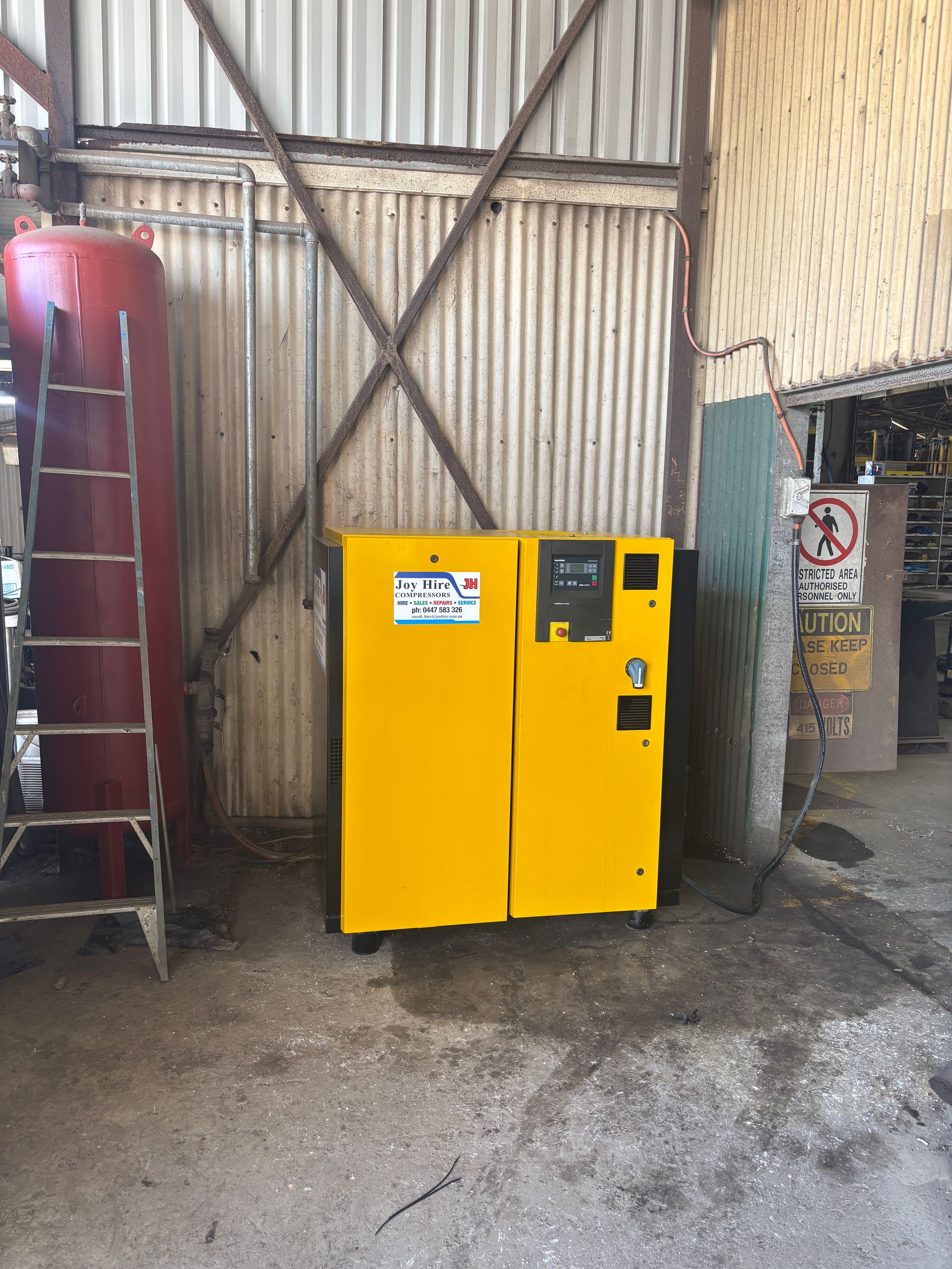 Generators Under a Roofed Shelter. Gray and Black, Outdoors — Joy Hire Compressor Hire & Maintenance in Paget, QLD