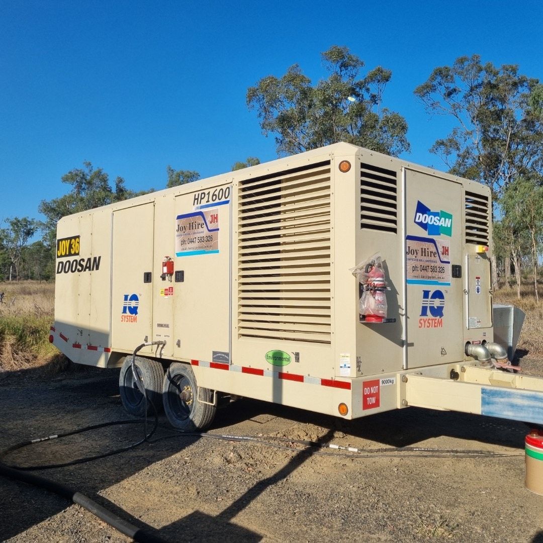 Generators Under a Roofed Shelter. Gray and Black, Outdoors — Joy Hire Compressor Hire & Maintenance in Paget, QLD