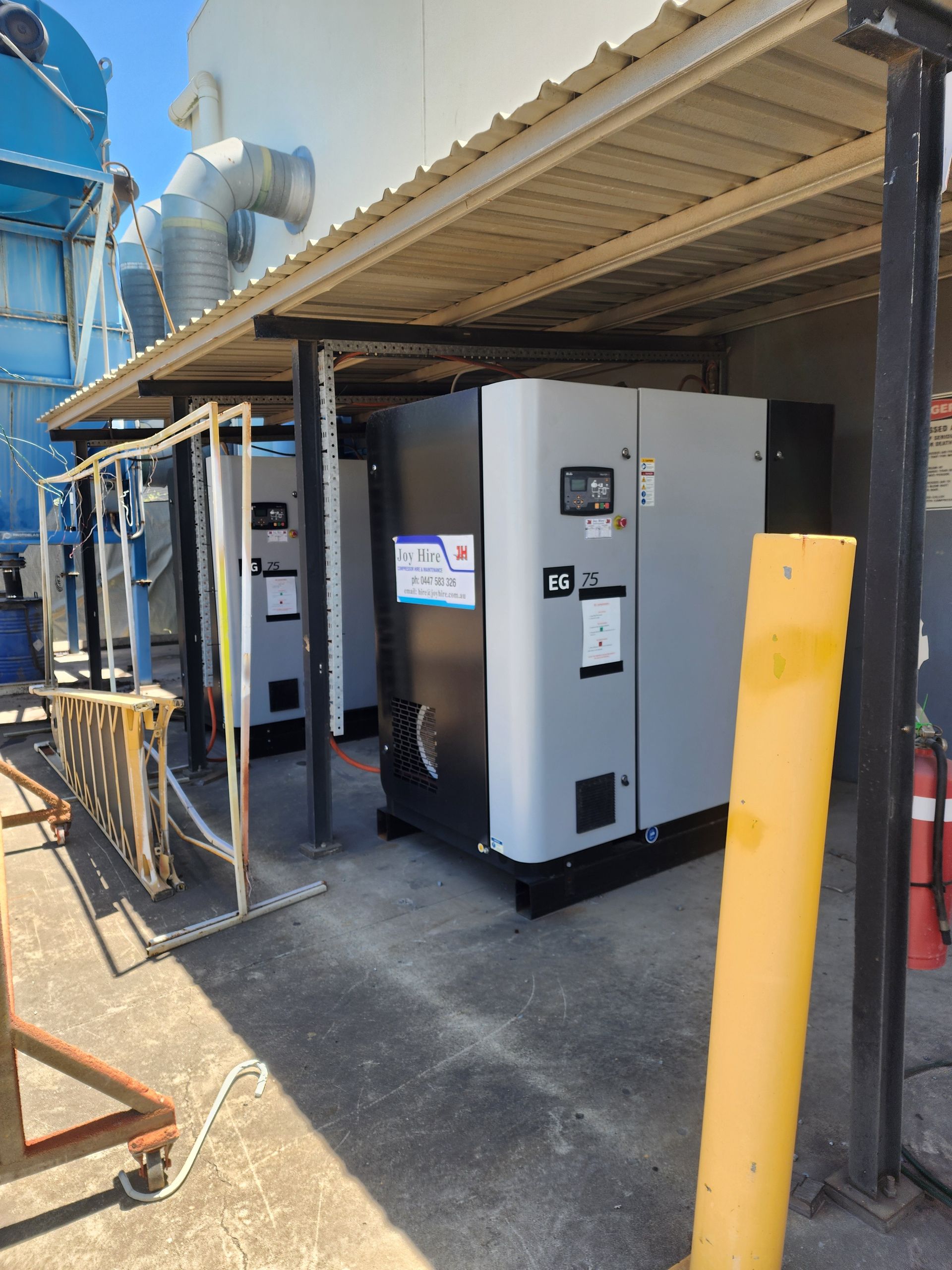 Generators Under a Roofed Shelter. Gray and Black, Outdoors — Joy Hire Compressor Hire & Maintenance in Paget, QLD