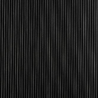 A close up of a black corrugated metal wall texture.