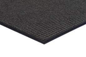 A close up of a black carpet on a white background.