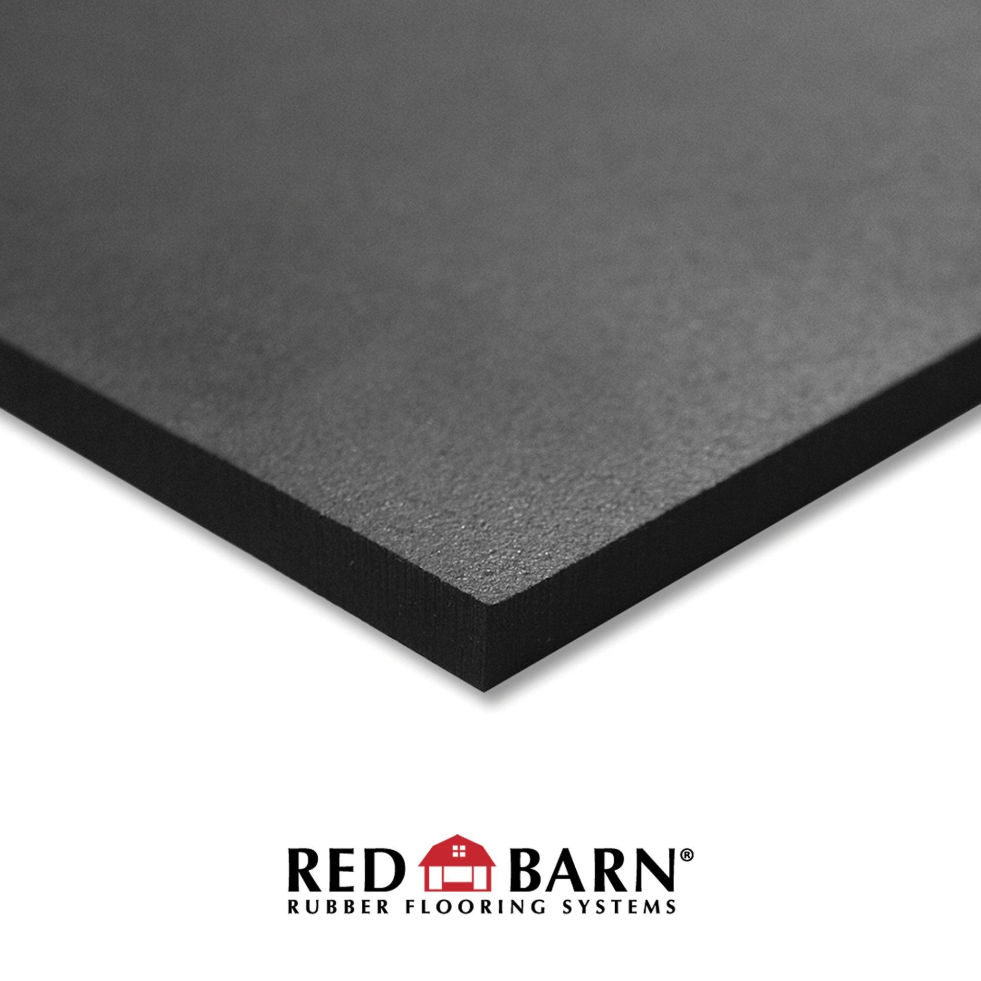 A black rubber flooring system from red barn