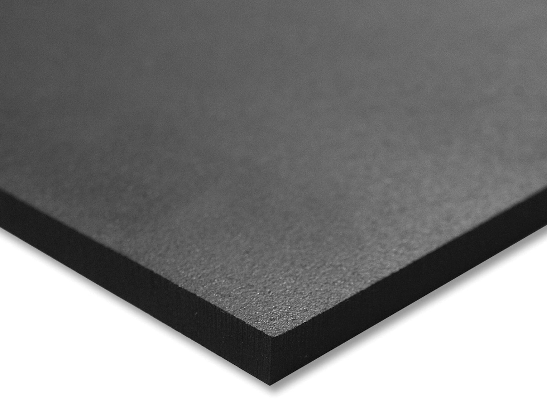 A close up of a piece of black foam on a white surface.