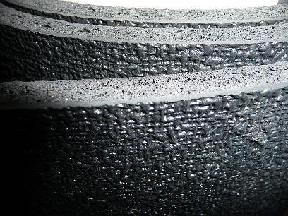 A close up of a piece of black rubber.