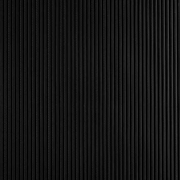 A close up of a black corrugated metal wall.