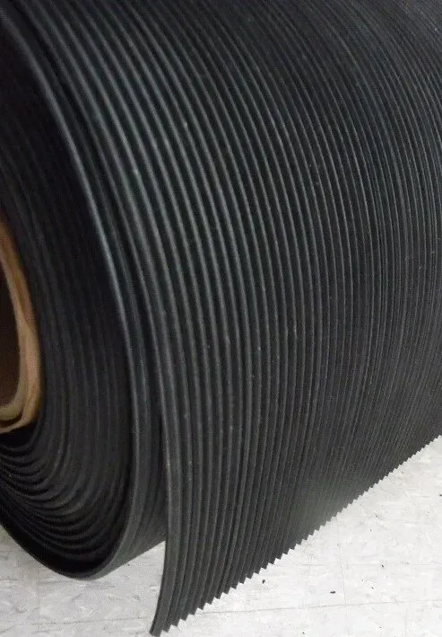 A roll of black rubber mat is sitting on a table.