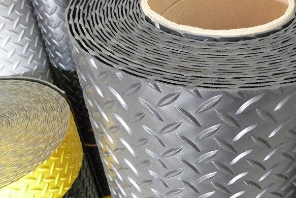 A close up of a roll of rubber with a diamond pattern