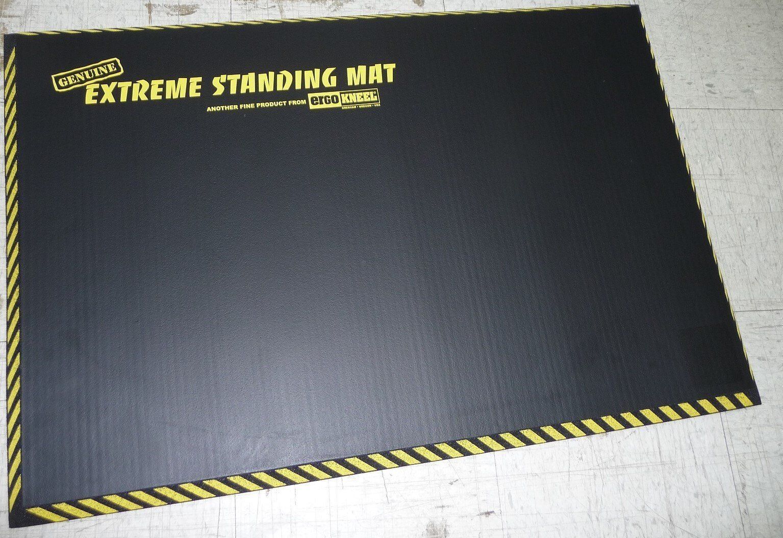 A black mat that says extreme standing mat on it