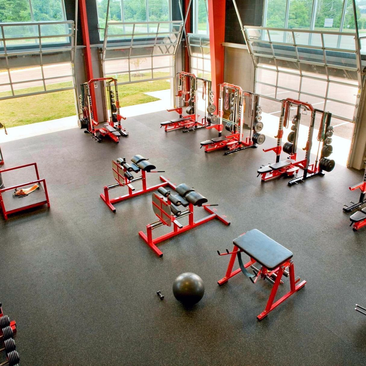 An aerial view of a gym with lots of red equipment