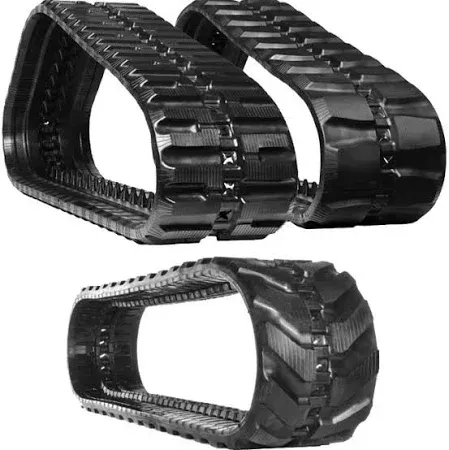 A close up of a machine 's tracks on gravel