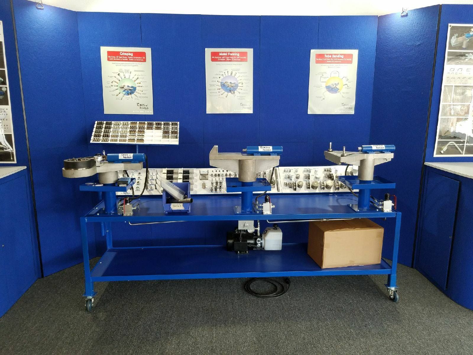 A blue table with a box on it in front of a blue wall