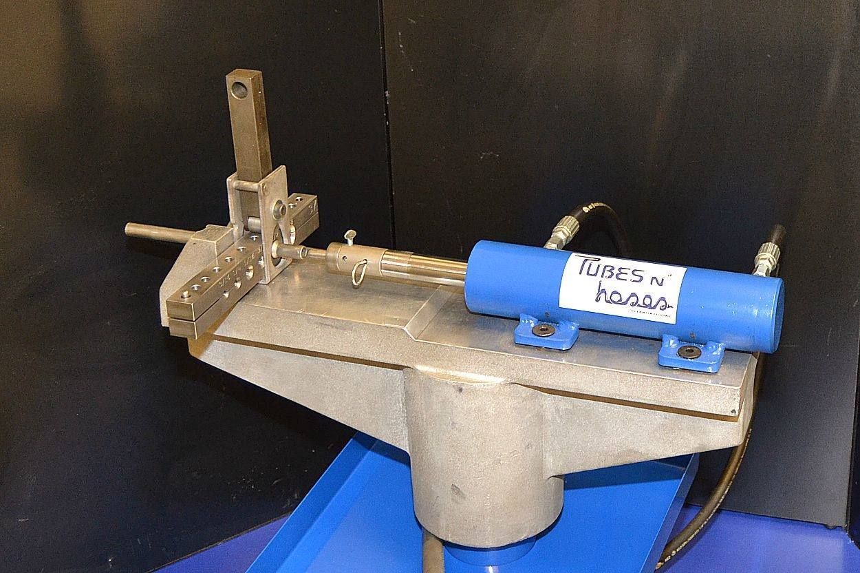 A machine with a blue cylinder that says green on it