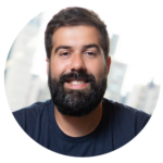 A man with a beard is smiling in a circle.
