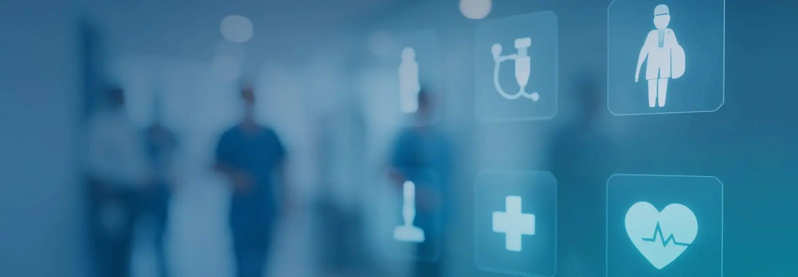 A group of people are walking down a hallway in a hospital.
