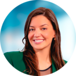 A woman in a green jacket is smiling in a circle.