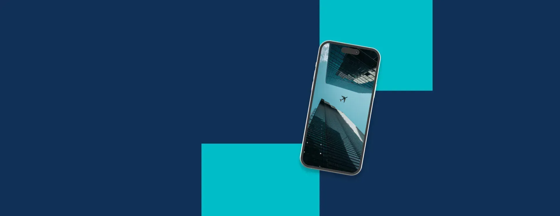 A broken cell phone is sitting on a blue and white background.