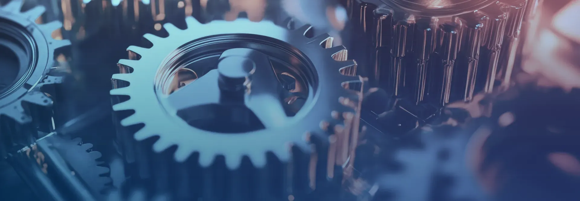 A close up of a group of gears on a blue background.